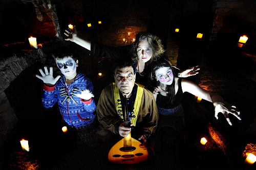 Storyteller Marion Kenny, Musician Mohammed Nafea and guisers Ollie and Sophie Somerville evoke stories at The Vaults